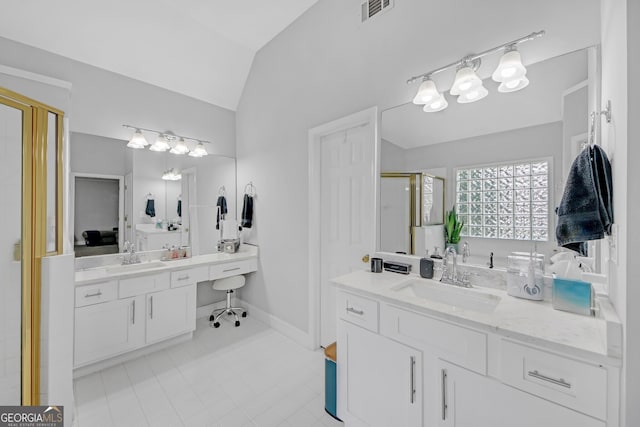 bathroom featuring vanity, lofted ceiling, and walk in shower