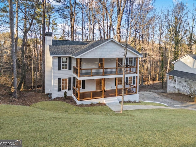 view of front of home featuring a porch and a front lawn