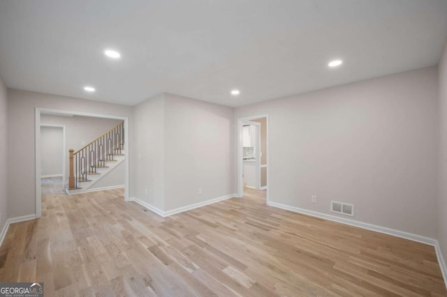 spare room featuring light hardwood / wood-style flooring