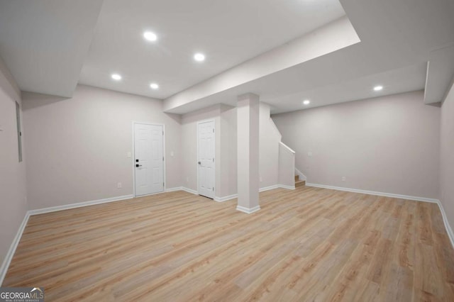 basement featuring light hardwood / wood-style flooring