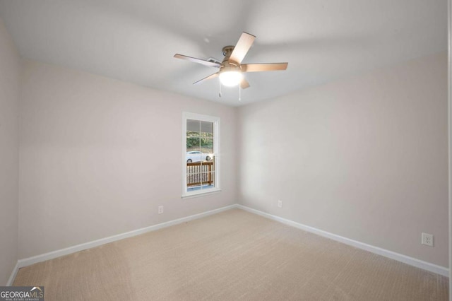 carpeted empty room with ceiling fan