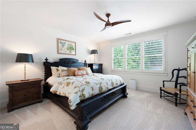 bedroom with ceiling fan and light colored carpet