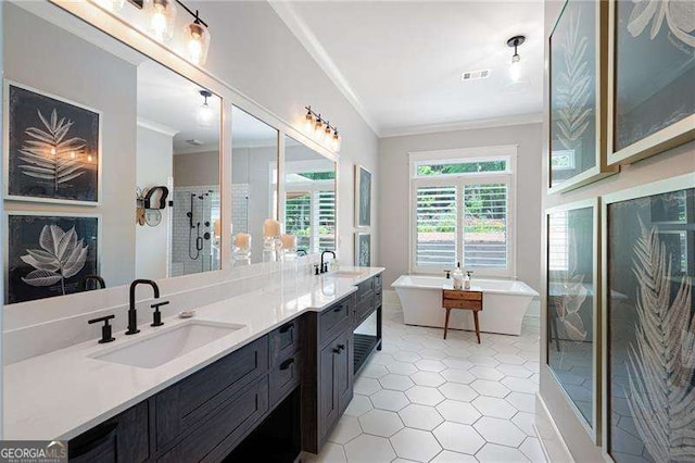 bathroom featuring vanity, crown molding, tile patterned floors, and plus walk in shower