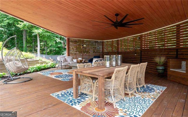 deck featuring outdoor lounge area and ceiling fan