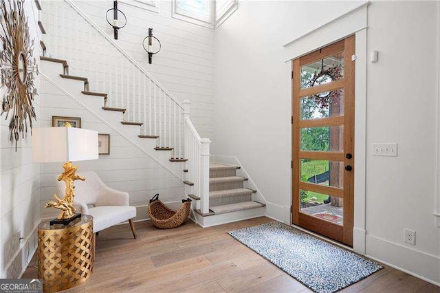 foyer entrance with light hardwood / wood-style floors