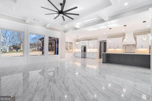 unfurnished living room featuring marble finish floor, crown molding, a ceiling fan, and recessed lighting