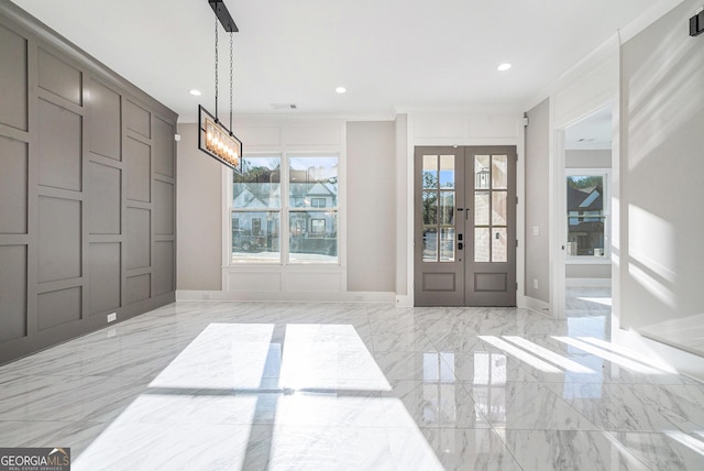 entryway featuring recessed lighting, marble finish floor, crown molding, and french doors