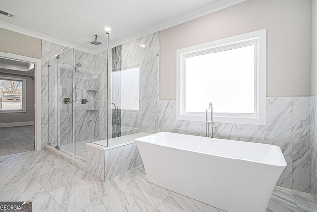 bathroom featuring marble finish floor, crown molding, a marble finish shower, visible vents, and a freestanding tub