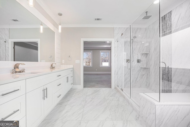 bathroom featuring marble finish floor, a sink, visible vents, and crown molding