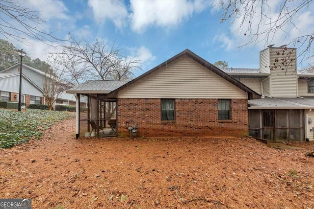 back of property featuring a sunroom