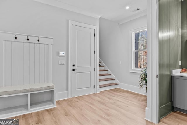 mudroom with light hardwood / wood-style floors