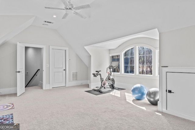 exercise area featuring light carpet, lofted ceiling, and ceiling fan