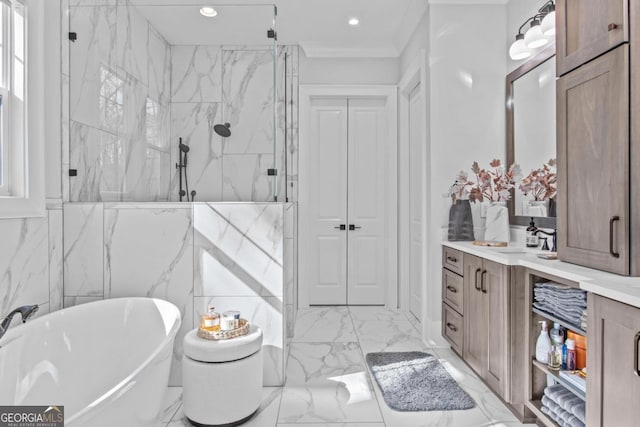 bathroom featuring vanity and shower with separate bathtub