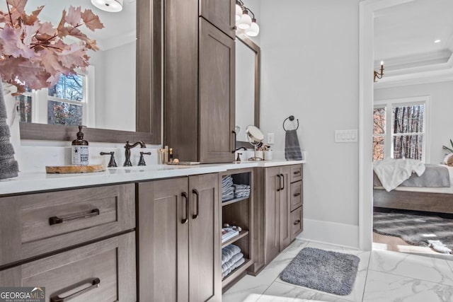 bathroom with vanity and ornamental molding