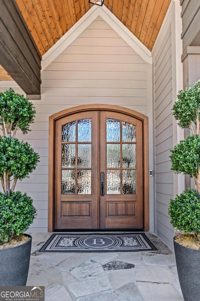 view of exterior entry featuring french doors