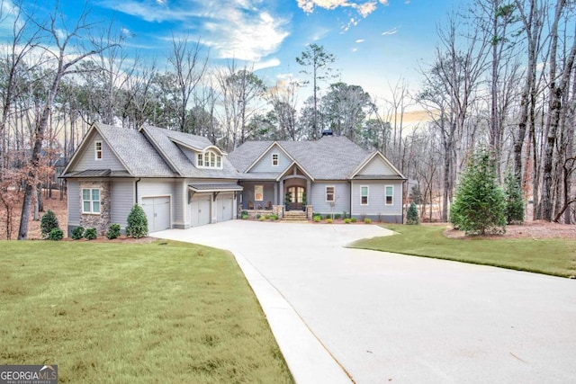 view of front facade featuring a garage and a front lawn