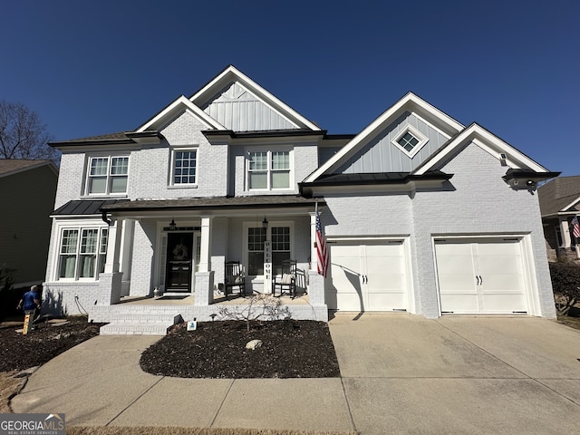 view of front facade featuring a garage and covered porch