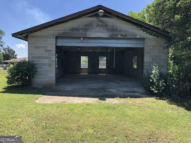 garage featuring a yard