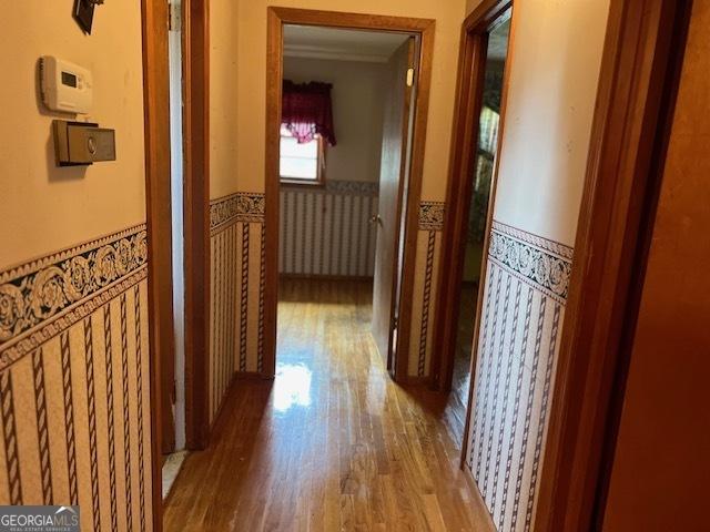 corridor featuring light hardwood / wood-style floors