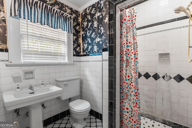 bathroom with walk in shower, toilet, crown molding, tile walls, and tile patterned flooring