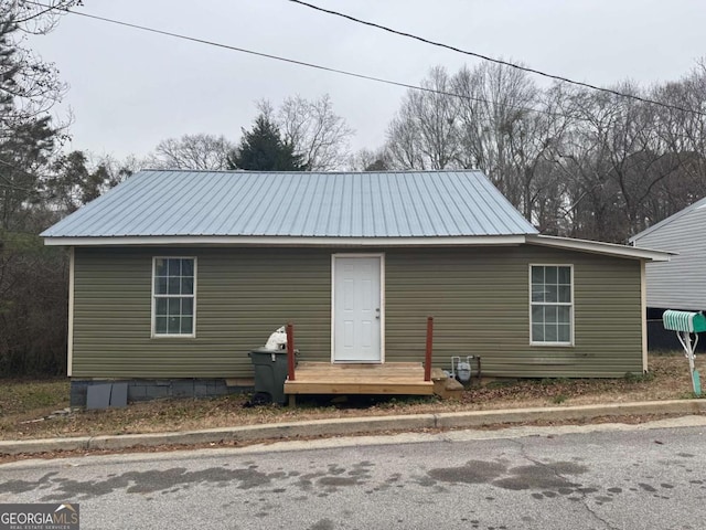 view of front of property featuring metal roof