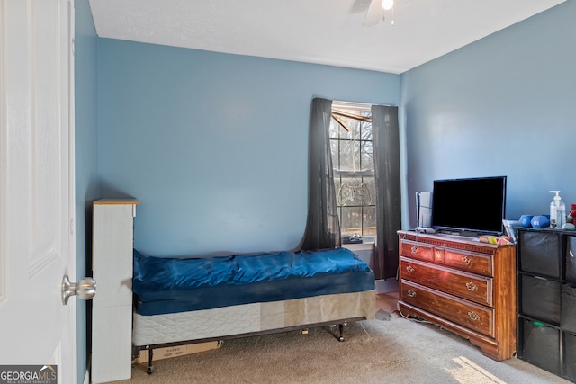 bedroom with ceiling fan and light colored carpet