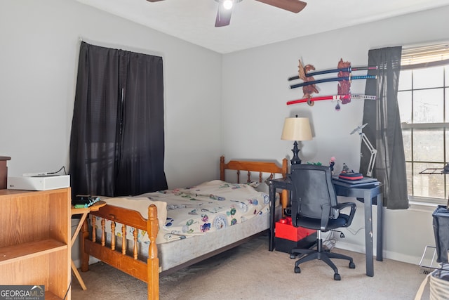 carpeted bedroom with ceiling fan