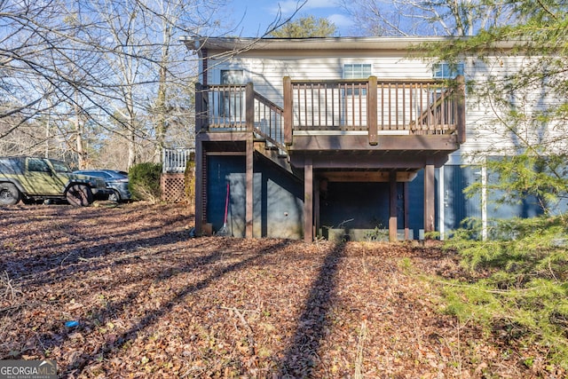 back of property with a wooden deck