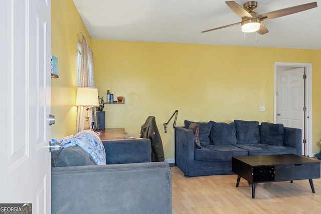 living room with ceiling fan and light hardwood / wood-style floors