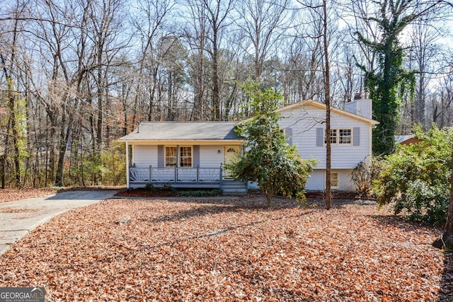 tri-level home featuring covered porch