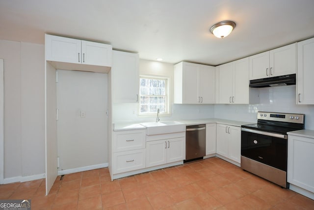 kitchen featuring white cabinetry, appliances with stainless steel finishes, sink, and decorative backsplash