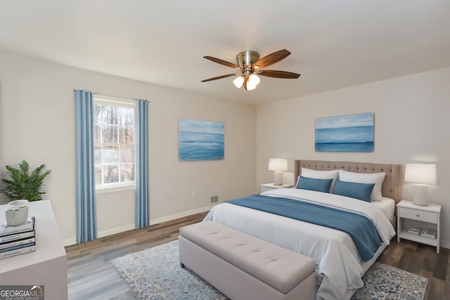 bedroom featuring hardwood / wood-style flooring and ceiling fan