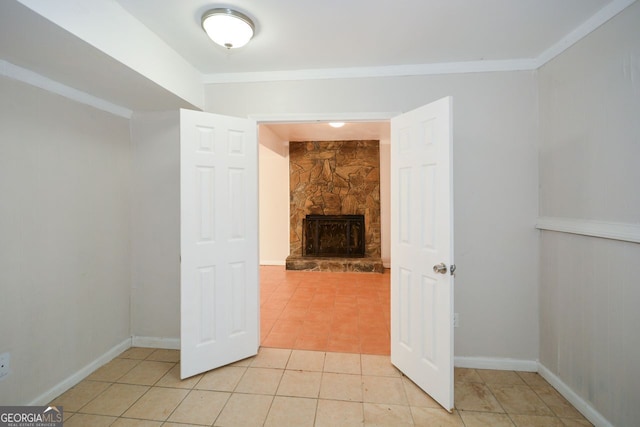 interior space with crown molding and a fireplace