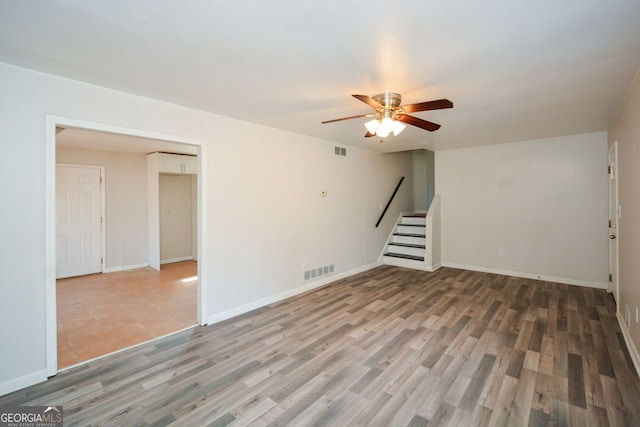 empty room with wood-type flooring and ceiling fan