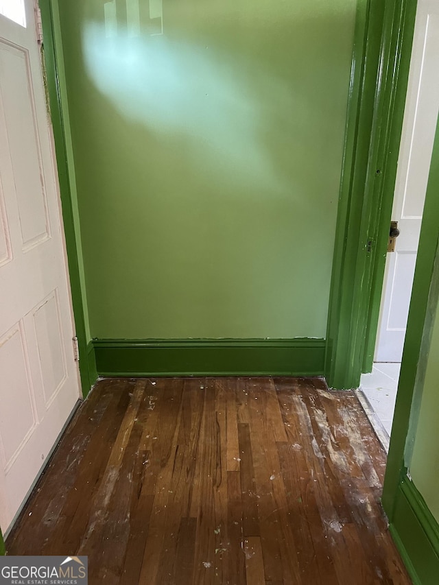 unfurnished room featuring dark hardwood / wood-style floors