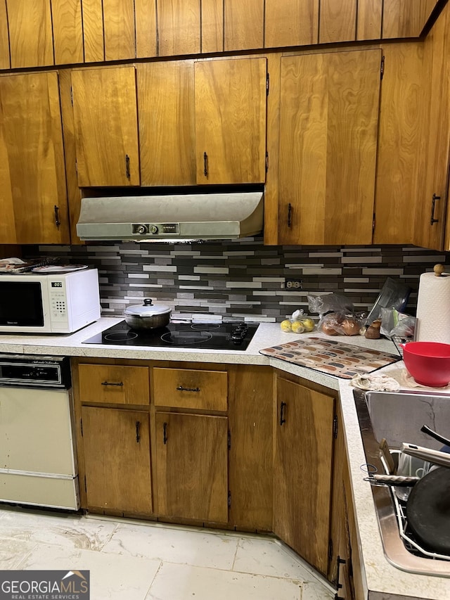 kitchen featuring black electric cooktop, tasteful backsplash, and cooktop