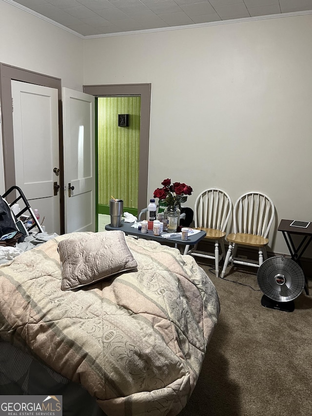 carpeted bedroom with ornamental molding