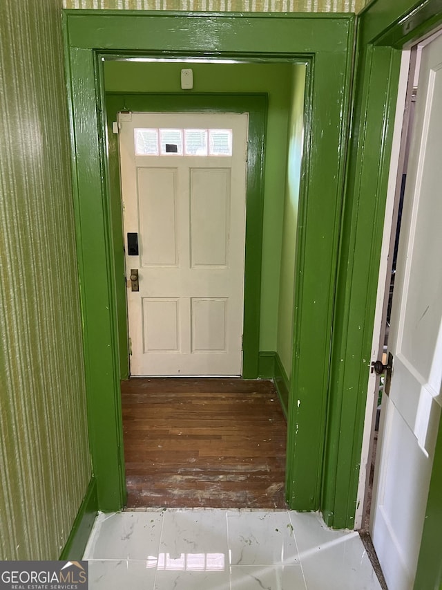 doorway with wood-type flooring