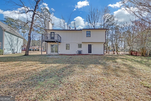 rear view of property with central AC, a lawn, and a balcony