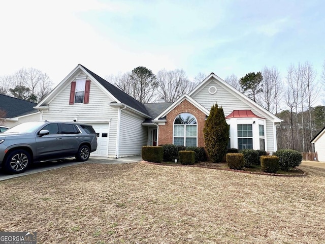 front facade with a garage and a front yard