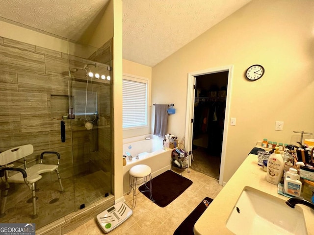 bathroom with lofted ceiling, vanity, independent shower and bath, and a textured ceiling