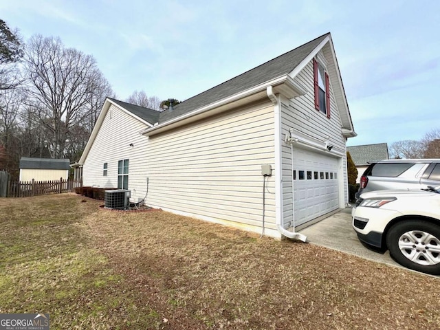 view of property exterior featuring a yard and central AC