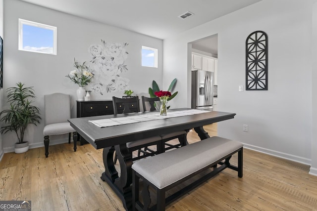 dining room featuring light hardwood / wood-style flooring