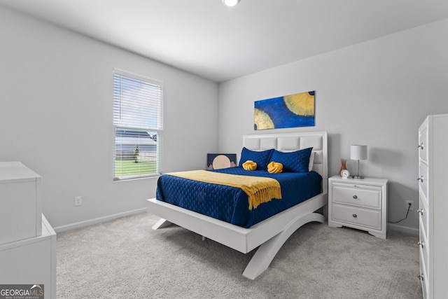 bedroom featuring light colored carpet