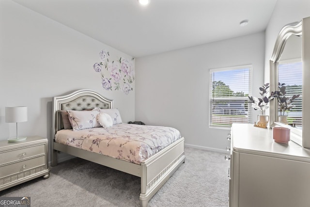 bedroom featuring light colored carpet