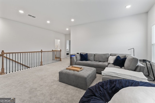 living room featuring light carpet