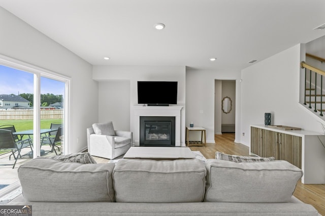 living room with light hardwood / wood-style floors