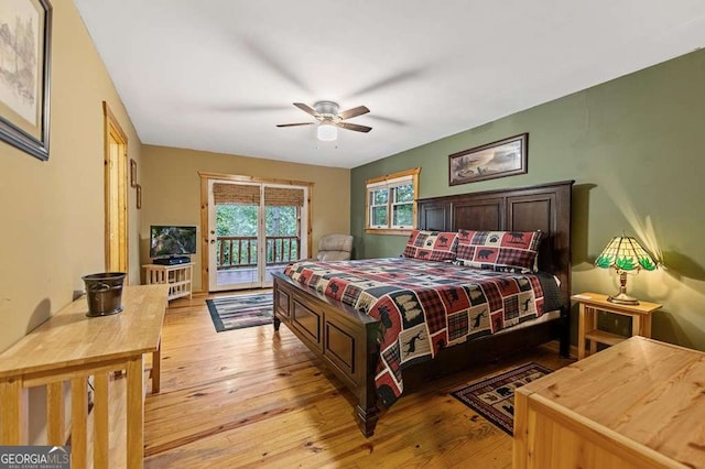 bedroom featuring access to exterior, ceiling fan, and light wood-type flooring