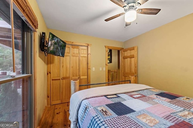 bedroom featuring wood-type flooring and ceiling fan