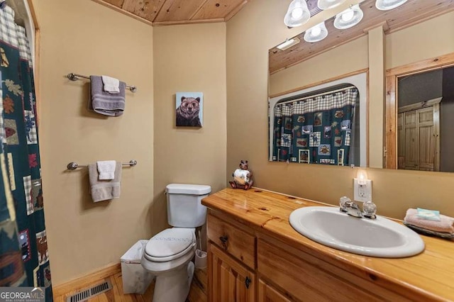 bathroom with vanity, wooden ceiling, and toilet